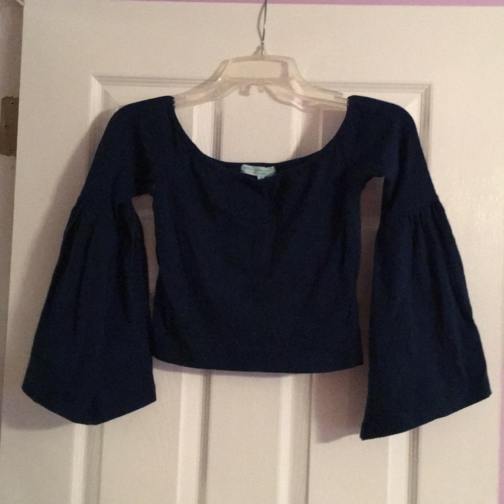 Deep teal colored bell sleeve crop top